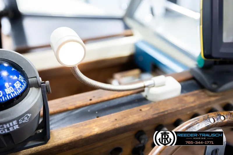 Slide: The Image of 1977 Searay 220 OV boat dashboard with compass and flexible reading light. - 36