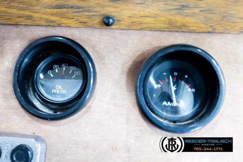 Slide: The Image of Oil pressure and ammeter gauges on a 1977 Searay 220 OV dashboard. - 39