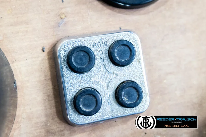 Slide: The Image of Control panel of a 1977 Searay 220 OV boat with four buttons. - 40