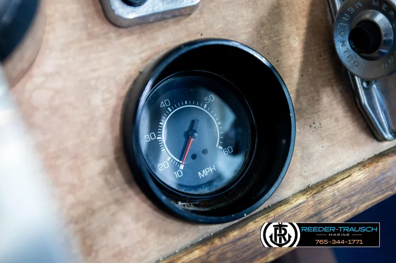 Slide: The Image of 1977 Searay 220 OV speedometer showing 10 MPH on wooden dashboard. - 41