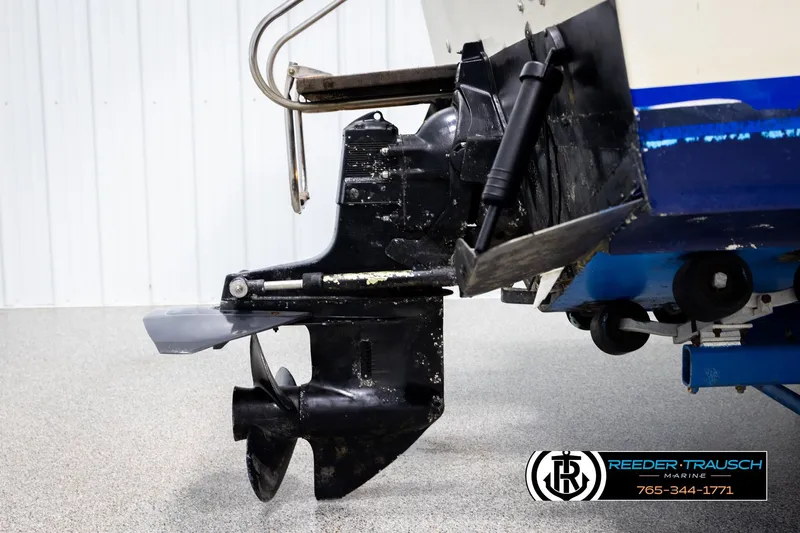 Slide: The Image of 1977 Searay 220 OV boat outdrive and propeller in a showroom setting. - 55