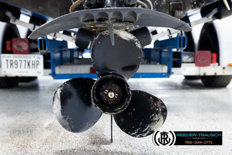 Slide: The Image of 1977 Searay 220 OV boat propeller close-up with trailer in background. - 57