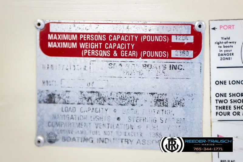 Slide: The Image of 1977 Searay 220 OV capacity plate showing weight and person limits, with marine safety instructions. - 63