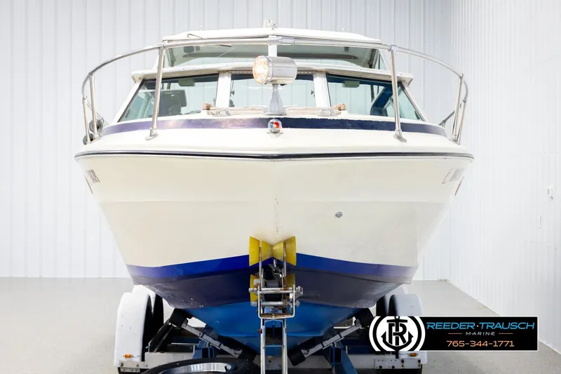 Slide: The Image of 1977 Searay 220 OV boat on trailer in indoor storage facility. - 7
