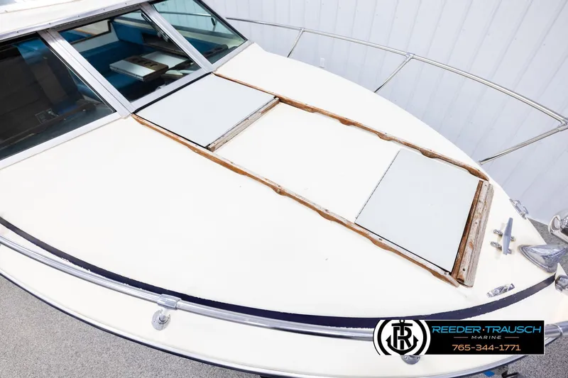 Slide: The Image of 1977 Searay 220 OV boat deck with windshield and railing, Reeder-Trausch Marine logo visible. - 8