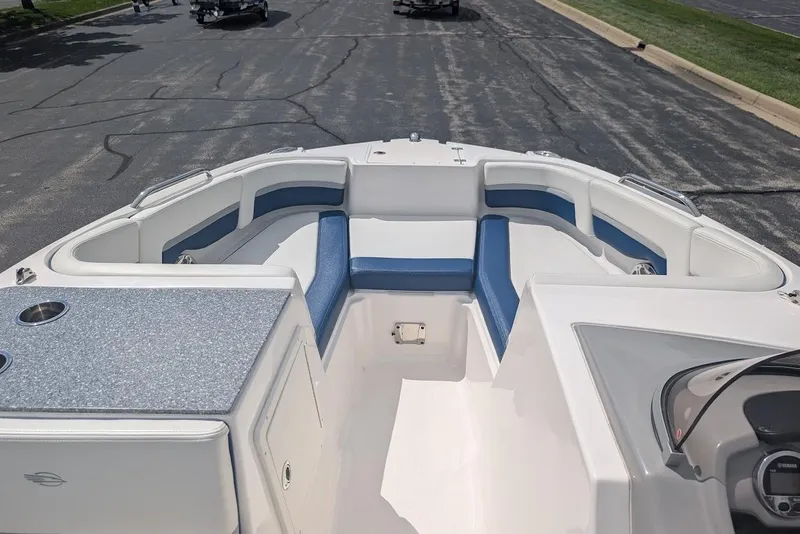 Slide: The Image of 2018 Chaparral 191 Suncoast boat interior with blue and white seating. - 15