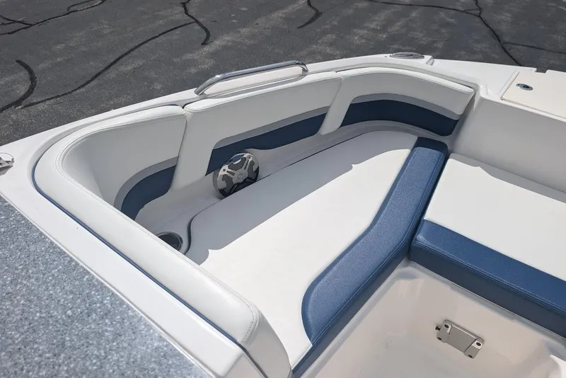 Slide: The Image of 2018 Chaparral 191 Suncoast boat interior with blue and white seating. - 16