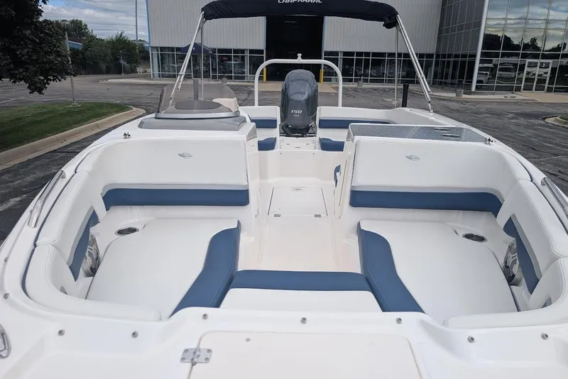 Slide: The Image of 2018 Chaparral 191 Suncoast boat interior with white and blue seating. - 22