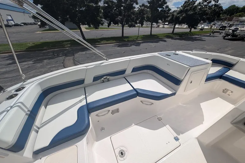 Slide: The Image of 2018 Chaparral 191 Suncoast boat interior with blue and white seating. - 7