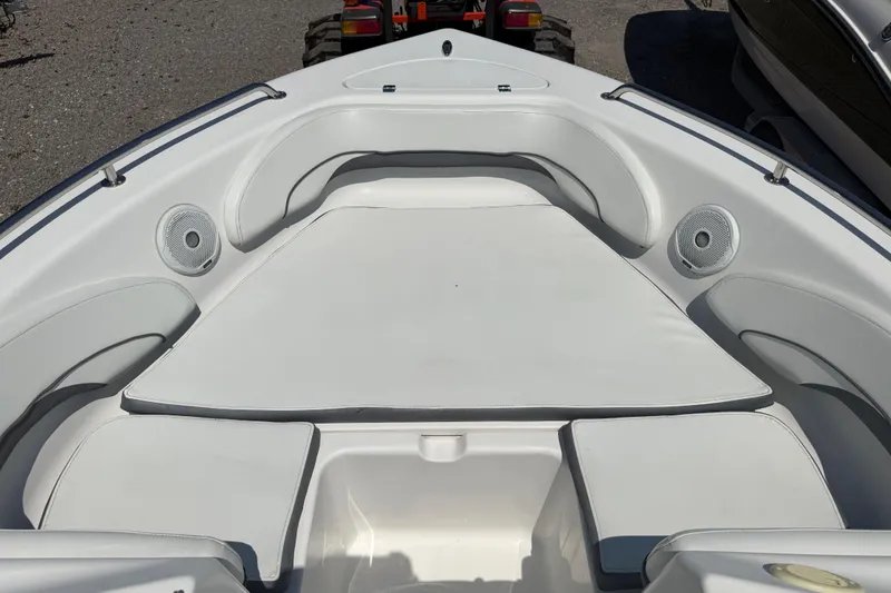 Slide: The Image of 2017 Tidewater 196 DC Explorer boat interior with cushioned seating and speakers. - 12