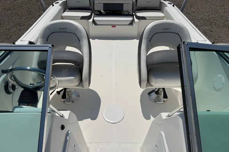 Slide: The Image of 2017 Tidewater 196 DC Explorer boat interior with dual seats and steering wheel. - 13