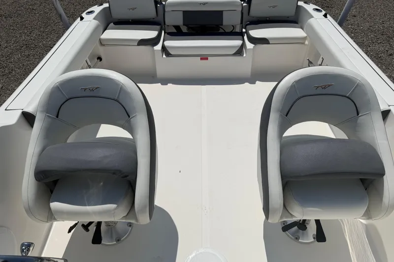 Slide: The Image of 2017 Tidewater 196 DC Explorer boat interior with two cushioned seats. - 14