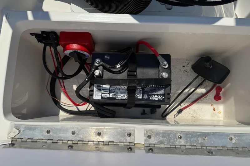 Slide: The Image of Battery compartment of 2017 Tidewater 196 DC Explorer boat, featuring wiring and connections. - 18