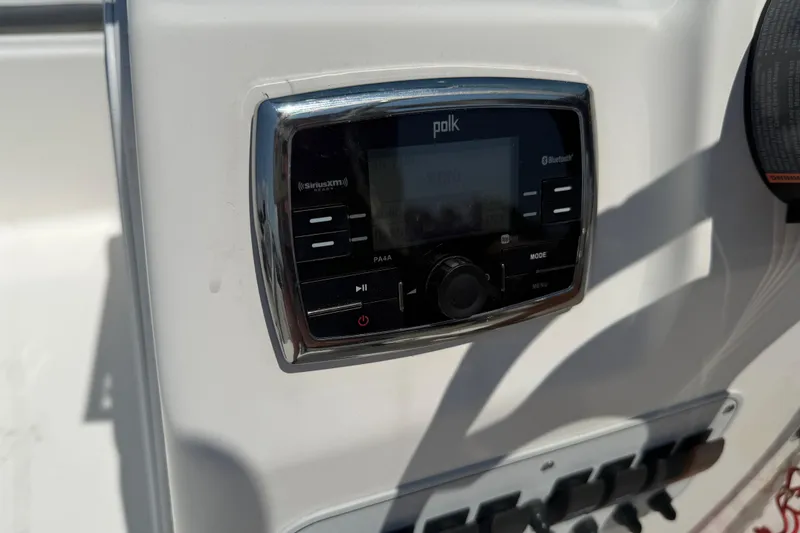 Slide: The Image of Polk audio system on 2017 Tidewater 196 DC Explorer boat dashboard. - 21