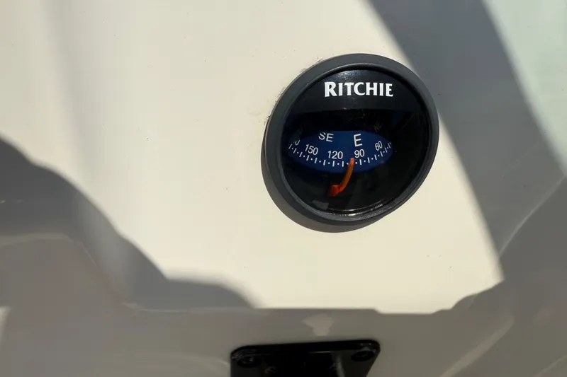 Slide: The Image of Compass on 2017 Tidewater 196 DC Explorer boat dashboard. - 22