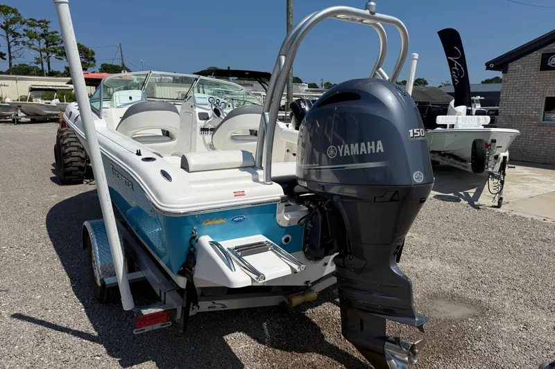 Slide: The Image of 2017 Tidewater 196 DC Explorer boat with Yamaha 150 engine, parked on gravel. - 4