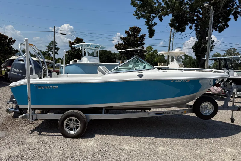 Slide: The Image of 2017 Tidewater 196 DC Explorer boat on trailer, blue and white design, parked outdoors. - 8