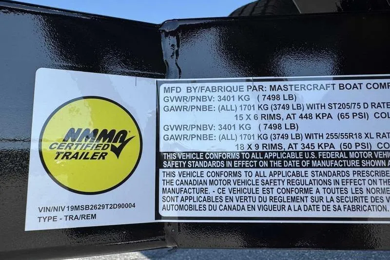 Slide: The Image of 2026 MasterCraft NXT22 trailer label with weight specifications and certification details. - 11
