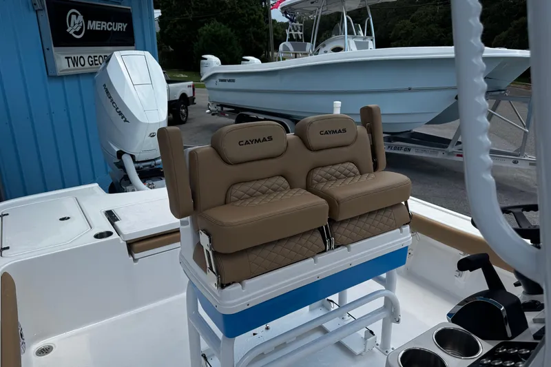 Slide: The Image of 2026 Caymas 28 HB boat with Mercury engine and cushioned seating. - 12
