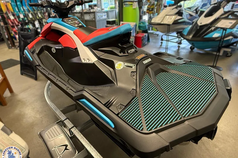 Slide: The Image of 2025 Yamaha WaveRunner JetBlaster DLX 2-Up in showroom, vibrant design, side view. - 3