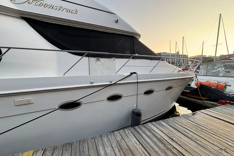 Slide: The Image of 1998 Carver 530 Voyager Pilothouse yacht docked at sunset. - 10