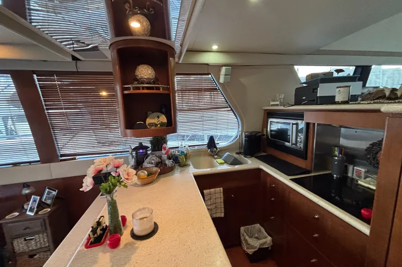 Slide: The Image of Luxurious kitchen interior of 1998 Carver 530 Voyager Pilothouse yacht with modern amenities. - 20