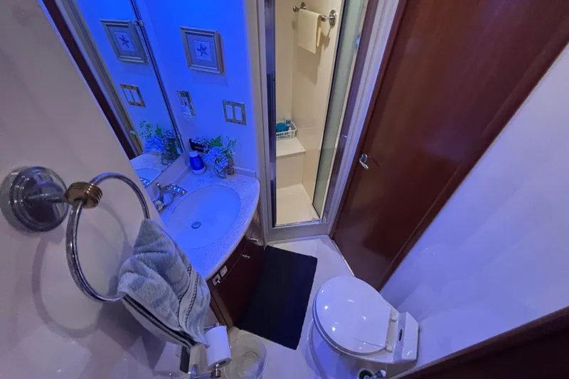 Slide: The Image of Bathroom interior of 1998 Carver 530 Voyager Pilothouse with sink, toilet, and shower. - 28