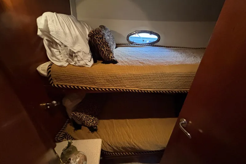 Slide: The Image of Bunk beds in 1998 Carver 530 Voyager Pilothouse cabin with leopard print pillows. - 31