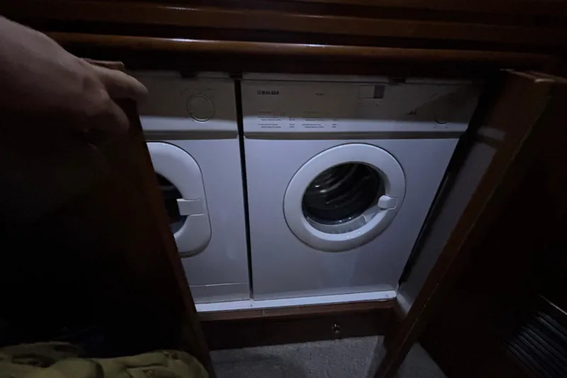Slide: The Image of Laundry appliances inside 1998 Carver 530 Voyager Pilothouse yacht. - 36