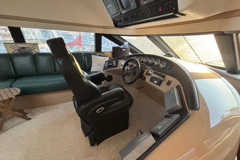 Slide: The Image of Interior of 1998 Carver 530 Voyager Pilothouse with helm and seating area. - 40