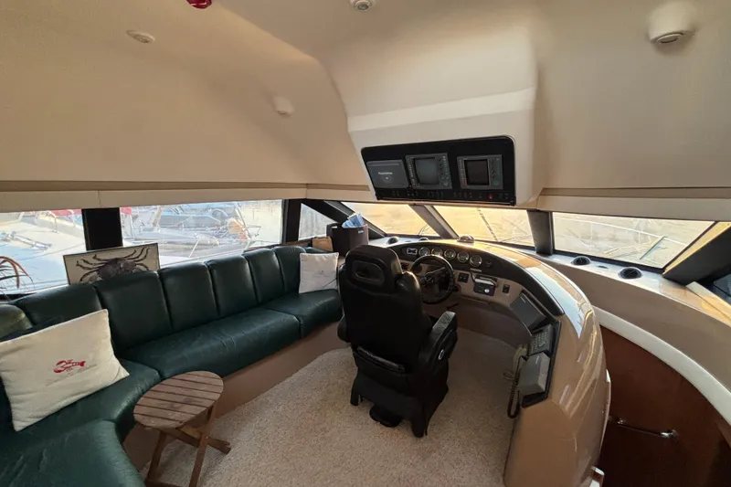 Slide: The Image of Interior of 1998 Carver 530 Voyager Pilothouse with helm and seating area. - 42