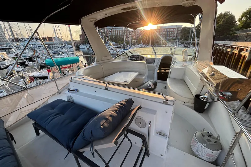 Slide: The Image of 1998 Carver 530 Voyager Pilothouse yacht interior at sunset, docked in a marina. - 48