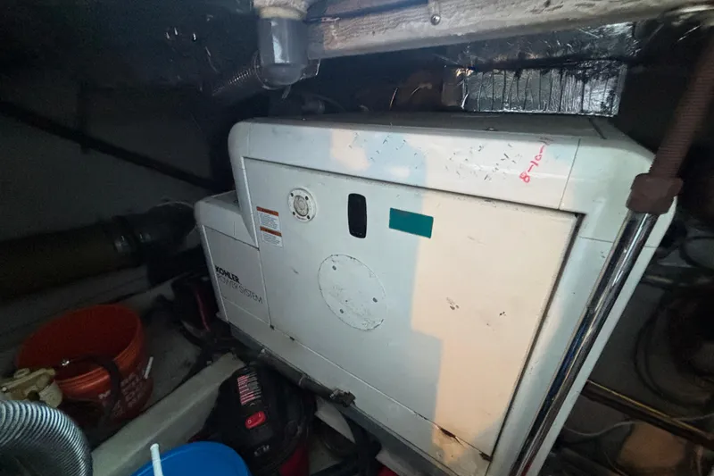 Slide: The Image of Engine room of 1998 Carver 530 Voyager Pilothouse with Kohler power system. - 49