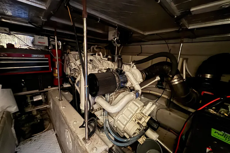 Slide: The Image of Engine room of a 1998 Carver 530 Voyager Pilothouse with visible machinery and equipment. - 50