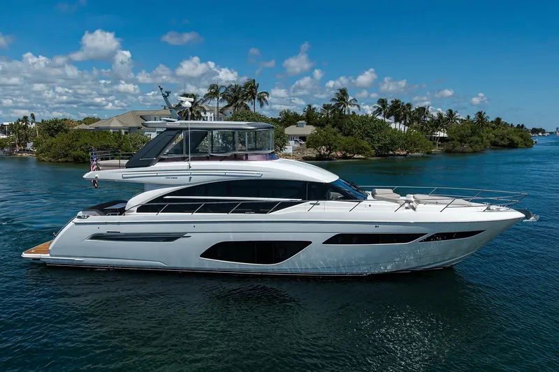 Slide: The Image of Luxurious 2020 Princess F70 yacht cruising on a sunny day, surrounded by tropical scenery. - 0