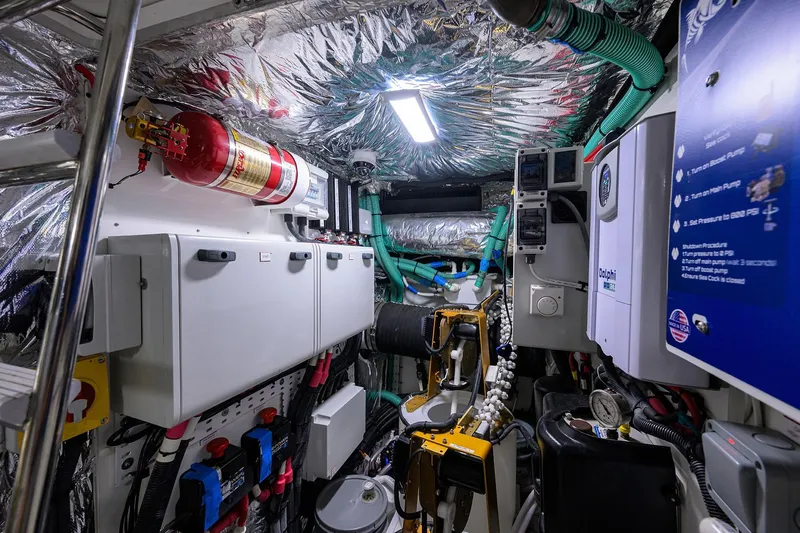 Slide: The Image of Engine room of a 2020 Princess F70 yacht, featuring advanced equipment and fire safety systems. - 102