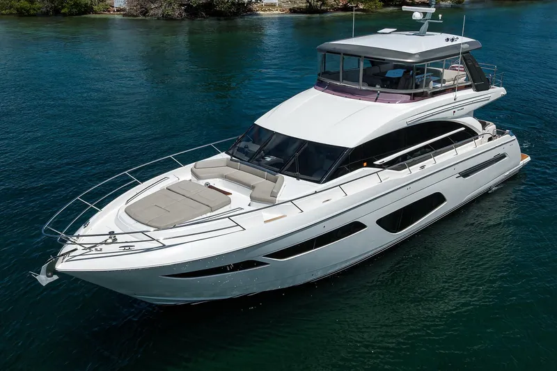 Slide: The Image of Luxury 2020 Princess F70 yacht cruising on serene waters. - 13