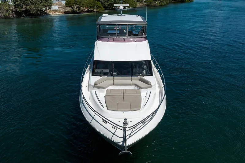 Slide: The Image of 2020 Princess F70 yacht on calm water, aerial view showcasing sleek design. - 14
