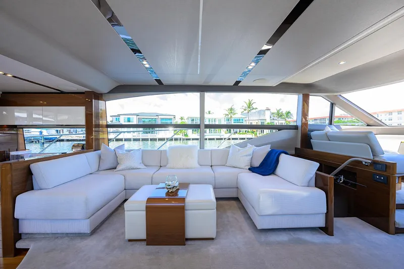 Slide: The Image of Luxurious interior of 2020 Princess F70 yacht with elegant white seating and waterfront view. - 19
