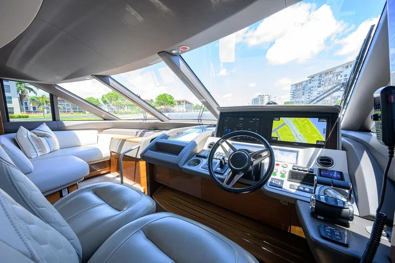 Slide: The Image of Luxurious 2020 Princess F70 yacht interior with modern navigation system and plush seating. - 2