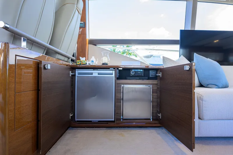 Slide: The Image of Luxurious interior of 2020 Princess F70 yacht with open cabinets and modern appliances. - 25