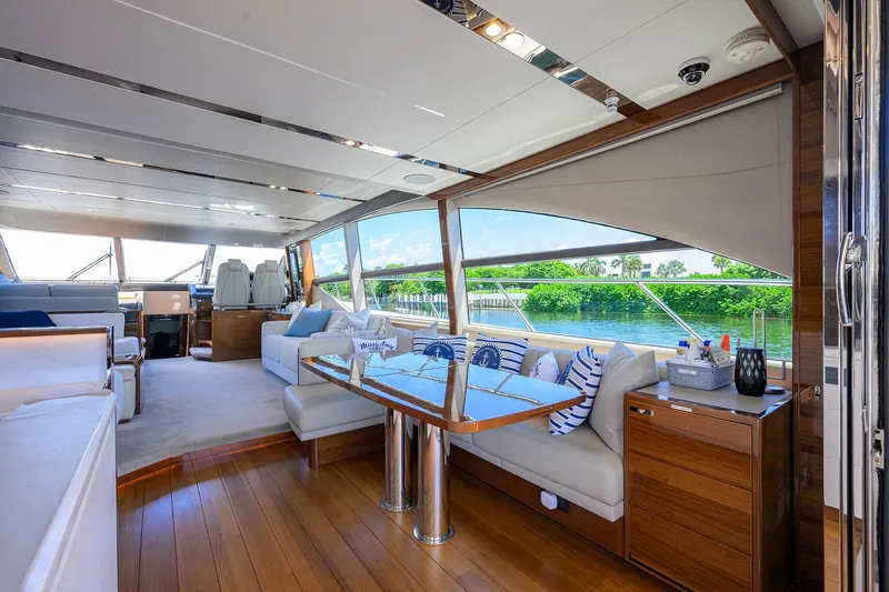 Slide: The Image of Luxurious 2020 Princess F70 yacht interior with elegant seating and scenic water views. - 31