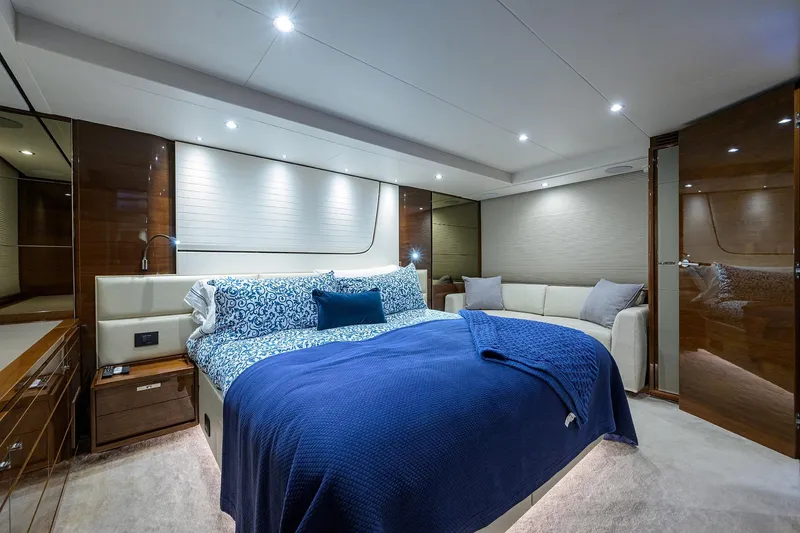 Slide: The Image of Luxurious bedroom interior of 2020 Princess F70 yacht with elegant blue bedding. - 34