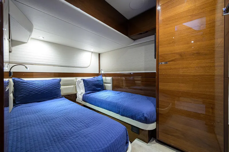 Slide: The Image of Luxurious cabin interior of 2020 Princess F70 yacht with twin beds and elegant wood finish. - 45