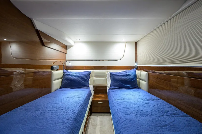 Slide: The Image of Luxurious twin cabin interior of 2020 Princess F70 yacht with blue bedding. - 48
