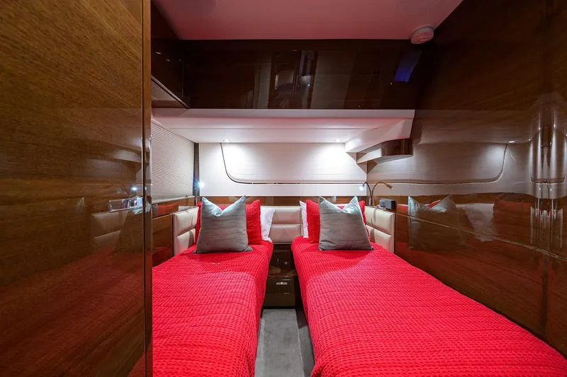 Slide: The Image of Luxurious 2020 Princess F70 yacht cabin with twin beds and red bedding. - 51