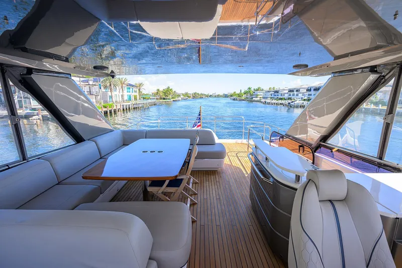 Slide: The Image of Luxurious 2020 Princess F70 yacht interior with elegant seating and scenic waterfront view. - 54