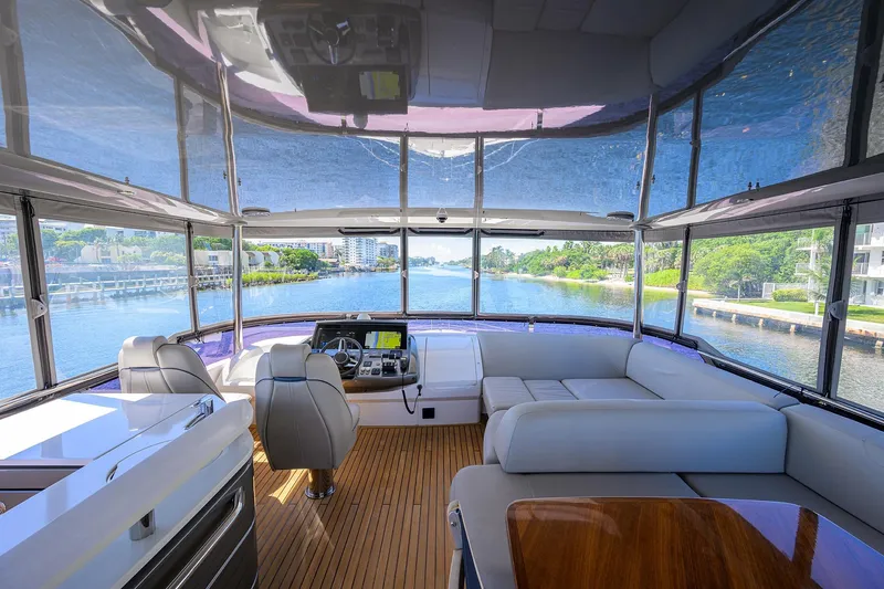 Slide: The Image of Luxurious 2020 Princess F70 yacht interior with panoramic water views and elegant seating. - 56