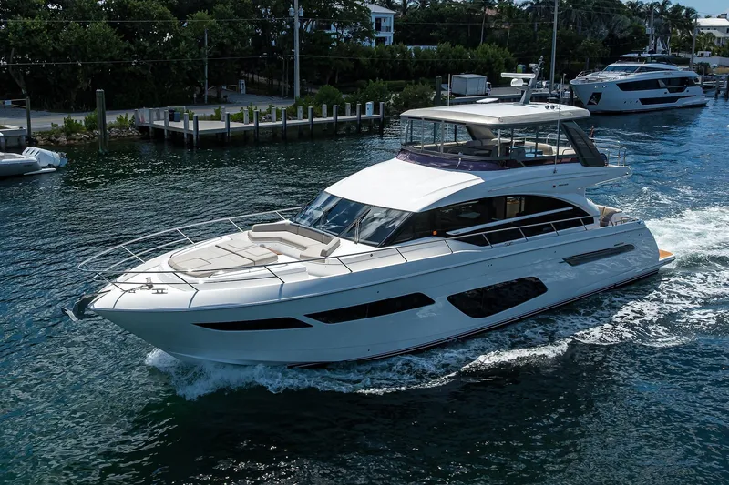 Slide: The Image of Luxurious 2020 Princess F70 yacht cruising on a serene waterway. - 6
