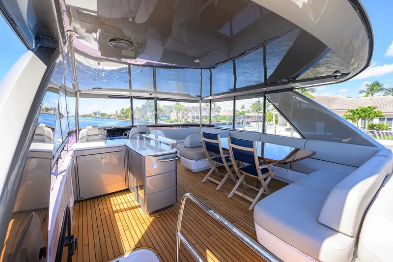 Slide: The Image of Luxurious 2020 Princess F70 yacht interior with elegant seating and dining area. - 65